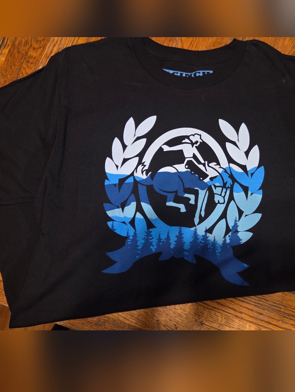 Black Graphic Tee with Blue Gradient Crest